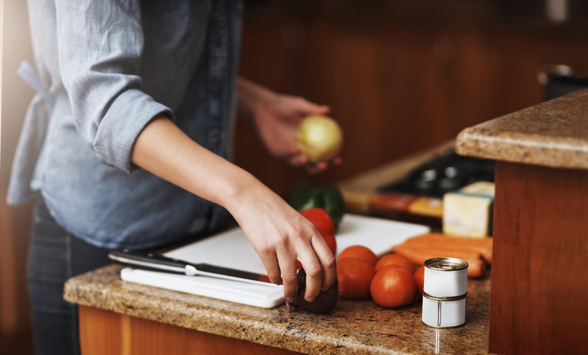 Instructor arranging ingredients on a small kitchen counter